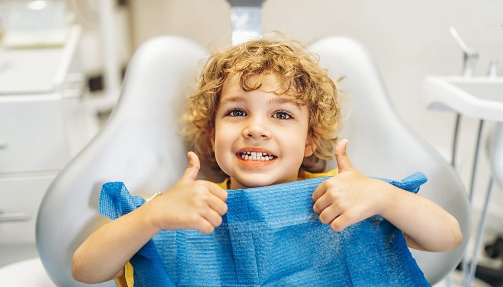 Happy,Cute,Little,Boy,In,Dental,Ofiice,Showing,Thumbs,Up